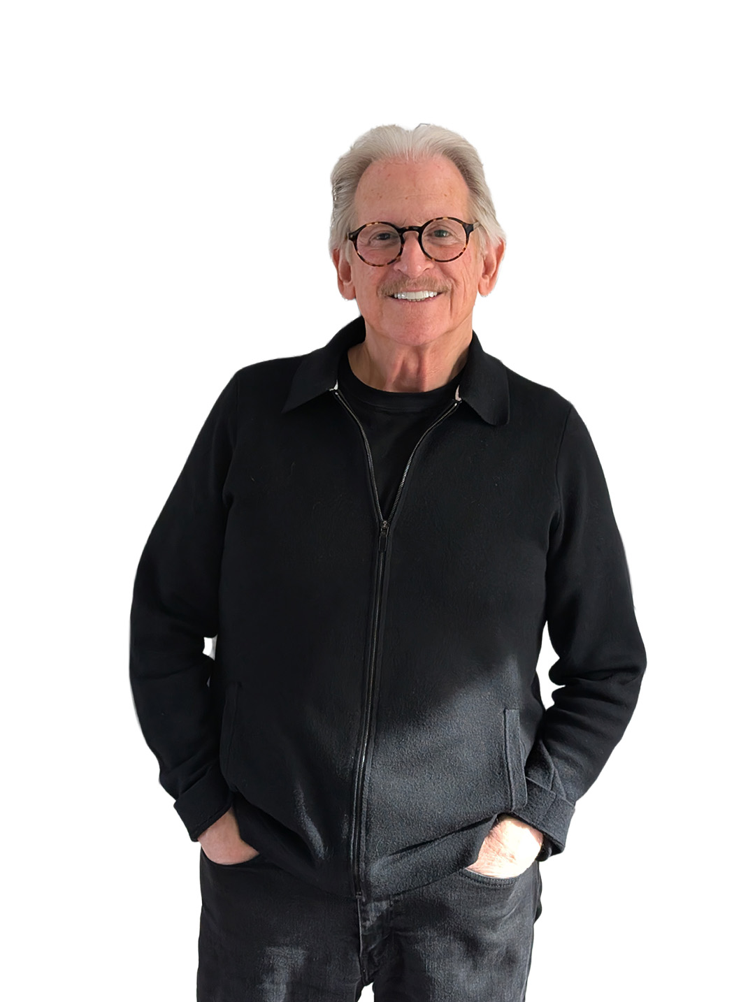 Harvey Smith standing in front of a blank wall