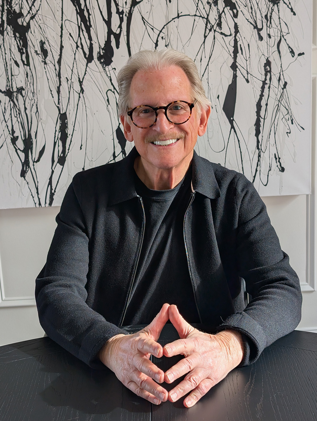 Harvey Smith seated hands showing